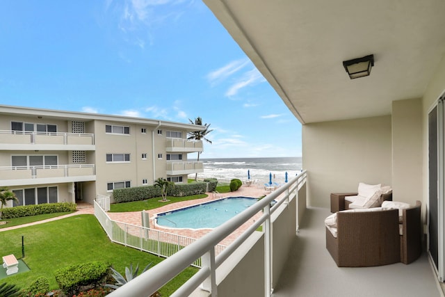 balcony featuring a water view