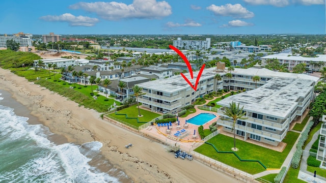 bird's eye view with a beach view and a water view