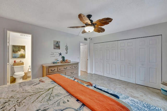 tiled bedroom featuring connected bathroom, ceiling fan, a closet, and a textured ceiling