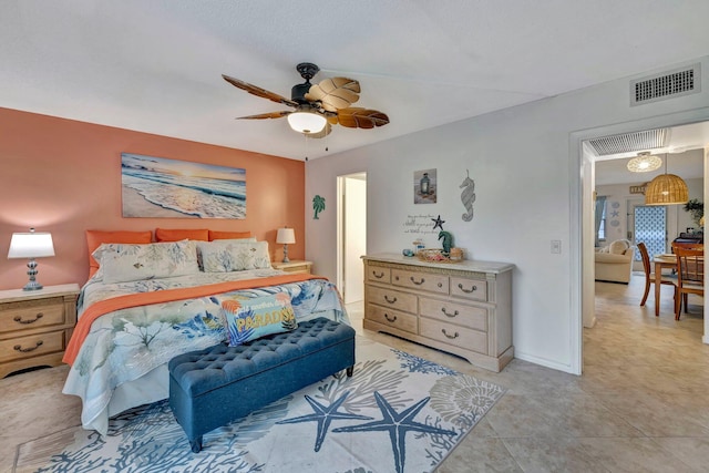 tiled bedroom with ceiling fan