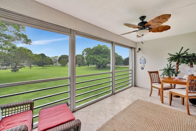 sunroom / solarium with ceiling fan