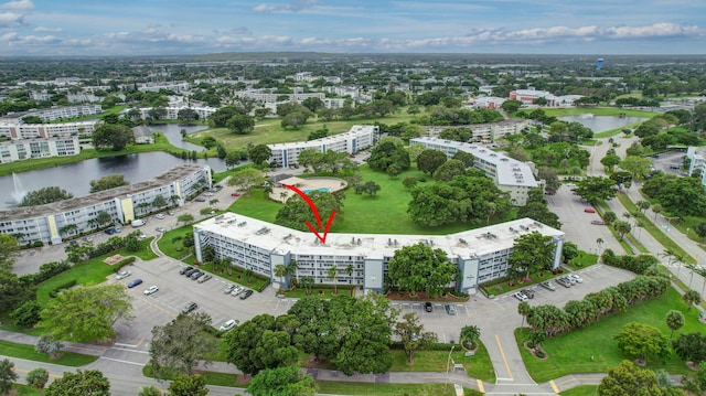 drone / aerial view with a water view