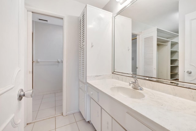 bathroom with tile patterned flooring and vanity