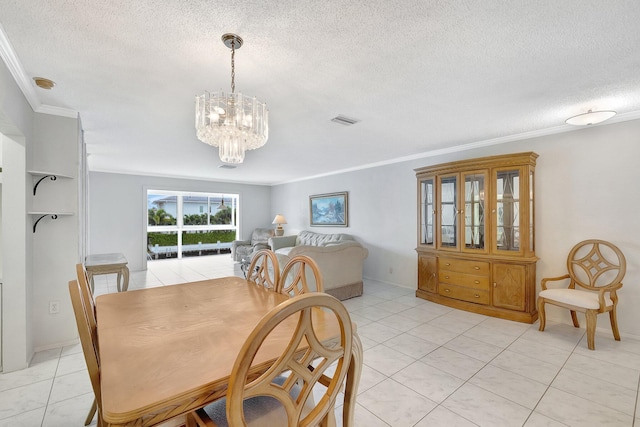 tiled dining space featuring crown molding, a textured ceiling, and a notable chandelier