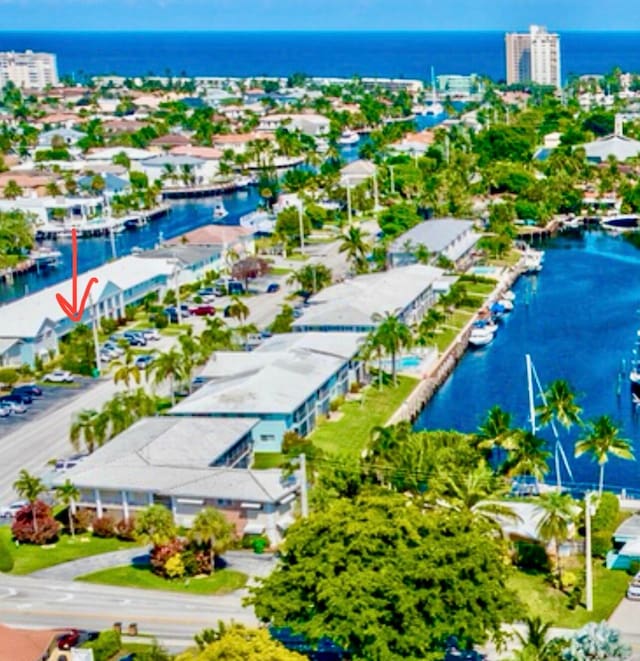 birds eye view of property featuring a water view