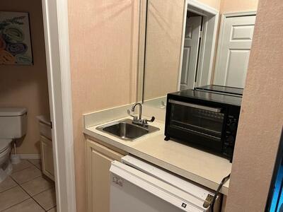 washroom with sink and light tile patterned floors