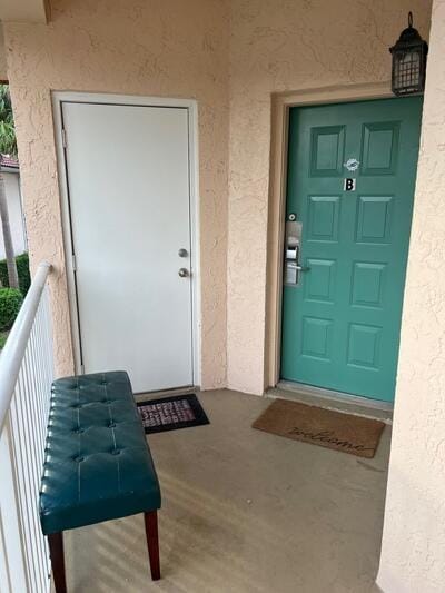 property entrance with a balcony