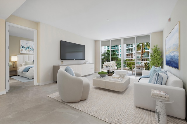 living room featuring floor to ceiling windows