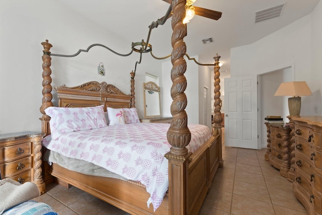 tiled bedroom featuring ceiling fan