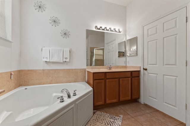 bathroom featuring vanity, independent shower and bath, and tile patterned floors