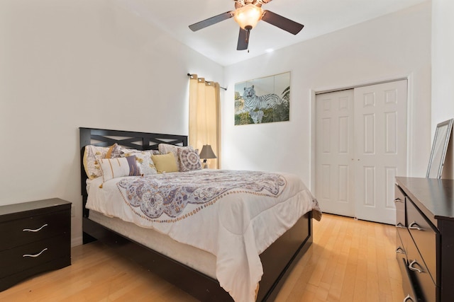 bedroom featuring a closet, light wood-type flooring, and ceiling fan