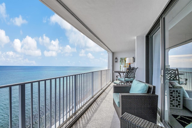 balcony featuring a water view