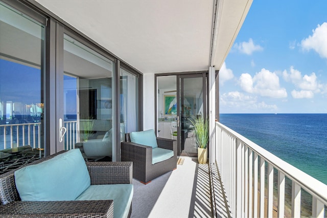 balcony featuring a water view