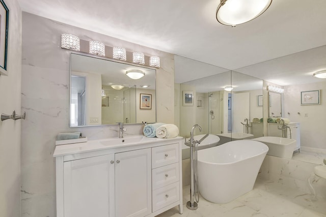 bathroom with vanity and independent shower and bath