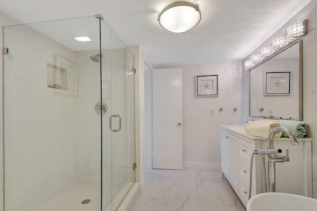 bathroom with vanity and a shower with door