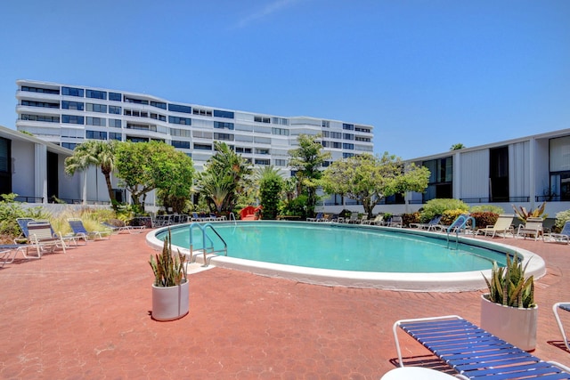 view of swimming pool with a patio