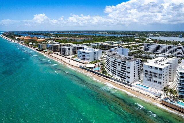 bird's eye view with a water view and a view of the beach