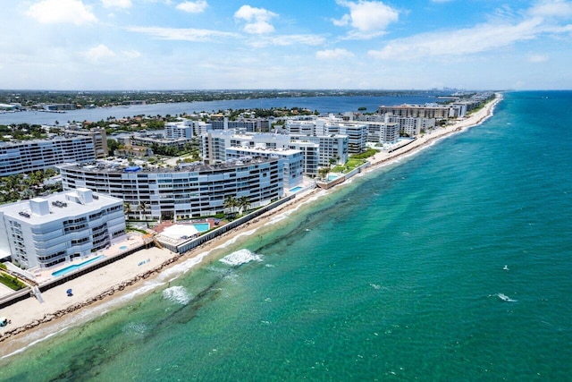 bird's eye view featuring a water view and a view of the beach