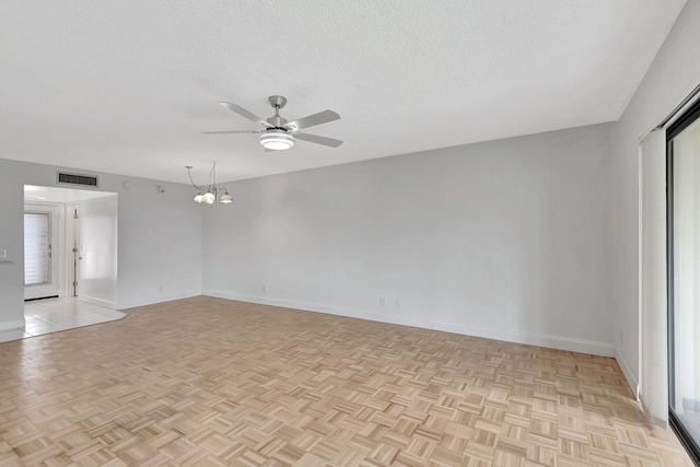 124 Capri C, Delray Beach, FL 33484 - unfurnished room featuring a ceiling fan, baseboards, a textured ceiling, and a chandelier