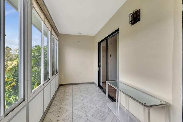 124 Capri C, Delray Beach, FL 33484 - unfurnished sunroom with healthy amount of natural light