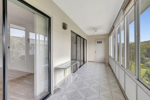 124 Capri C, Delray Beach, FL 33484 - unfurnished sunroom featuring ceiling fan