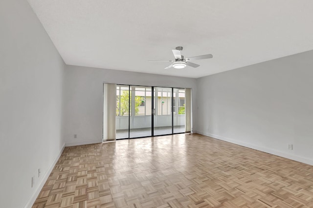 spare room featuring light parquet flooring and ceiling fan