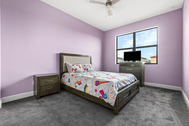 bedroom featuring ceiling fan and dark carpet