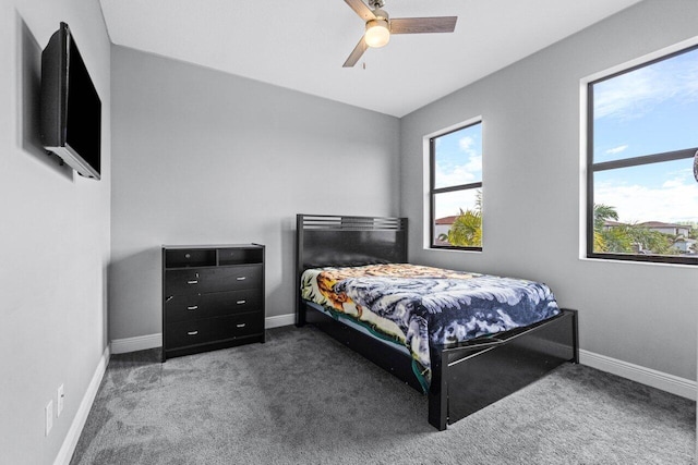 bedroom with dark carpet and ceiling fan