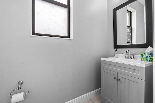 bathroom with tile patterned flooring and vanity