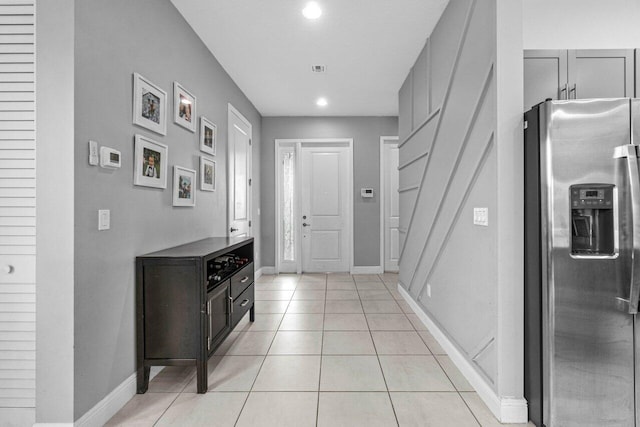 entrance foyer with light tile patterned flooring