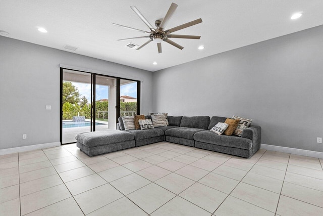 unfurnished living room featuring light tile patterned floors and ceiling fan