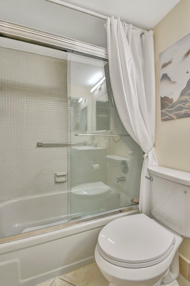 bathroom with toilet, bath / shower combo with glass door, and tile patterned floors