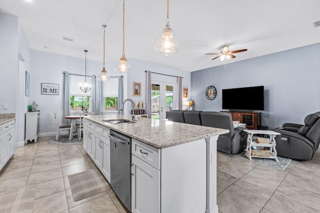 kitchen featuring white cabinetry, dishwasher, sink, and hanging light fixtures