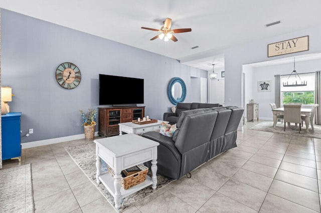 living room with light tile patterned flooring and ceiling fan