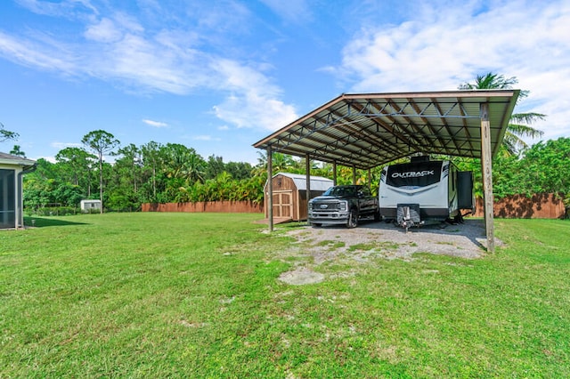 view of car parking with a yard and a carport