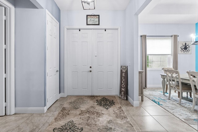 foyer featuring light tile patterned flooring