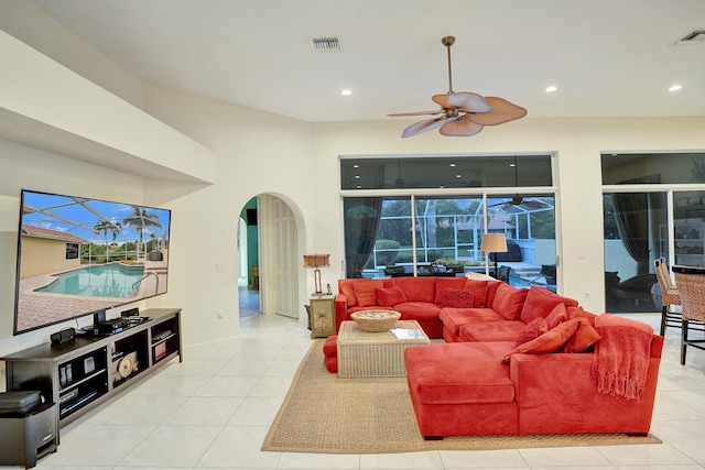 tiled living room featuring ceiling fan