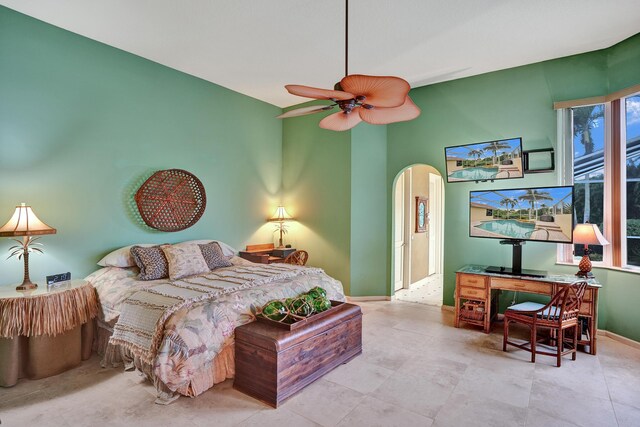 living room with light tile patterned floors, ceiling fan with notable chandelier, and sink