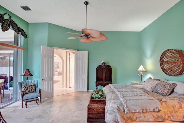 bedroom with access to exterior, a high ceiling, and ceiling fan