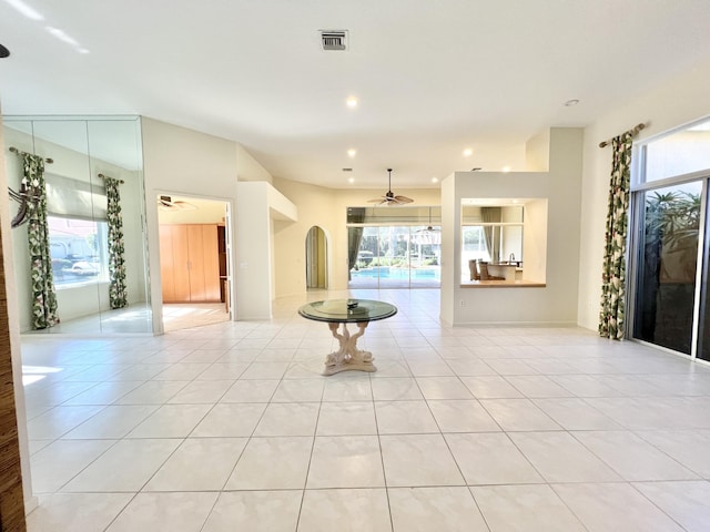 interior space with plenty of natural light and ceiling fan