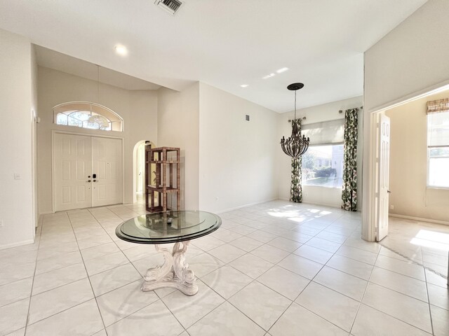 bathroom with tile patterned floors, vanity, toilet, and a shower with door