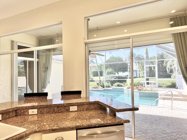 interior space with sink and ceiling fan