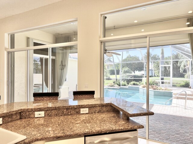 kitchen with light tile patterned floors, backsplash, ceiling fan, and appliances with stainless steel finishes