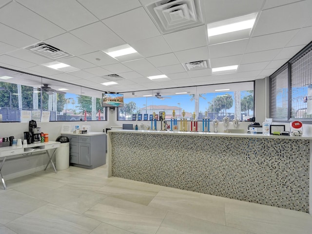 interior space with ceiling fan