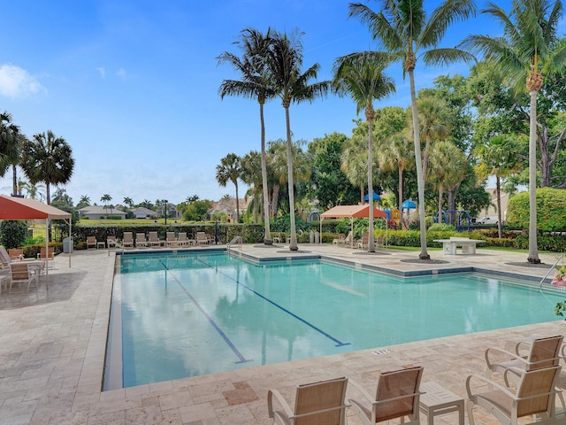 view of swimming pool featuring a patio area