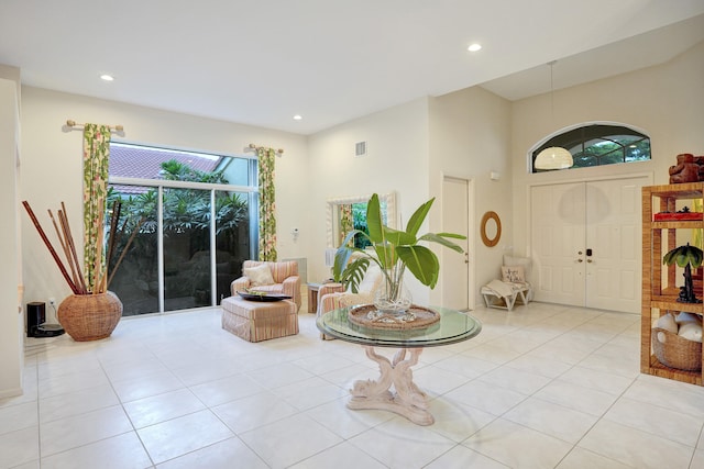 foyer entrance with light tile patterned floors