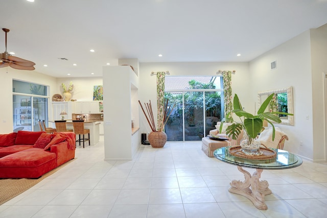 living room with light tile patterned floors and ceiling fan