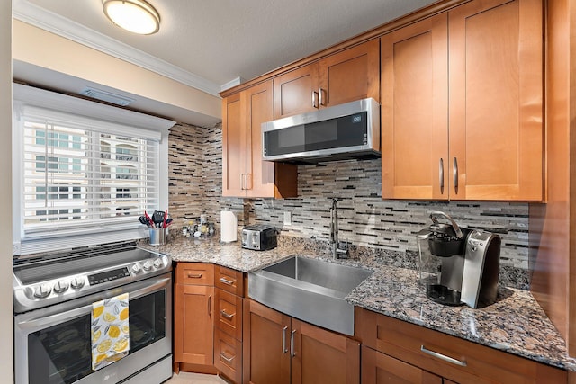 kitchen with crown molding, tasteful backsplash, stainless steel appliances, and sink