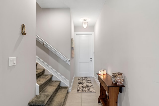 doorway featuring light tile patterned floors