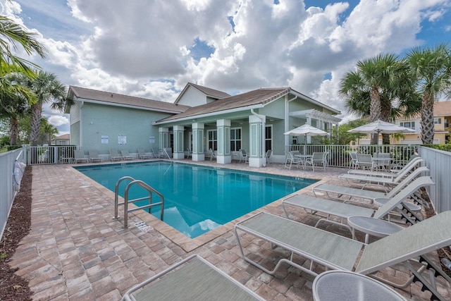 view of swimming pool with a patio